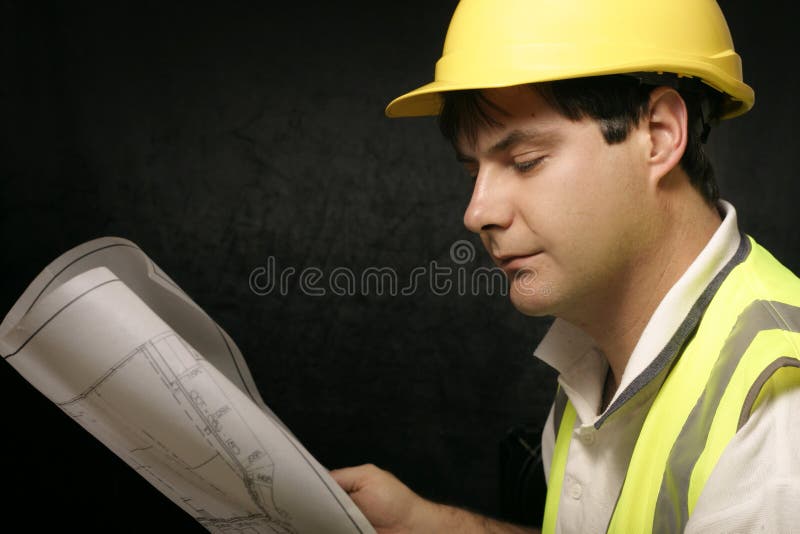 Workman or builder with architectural plans. Architect uniform stock images, royalty-free photos and pictures