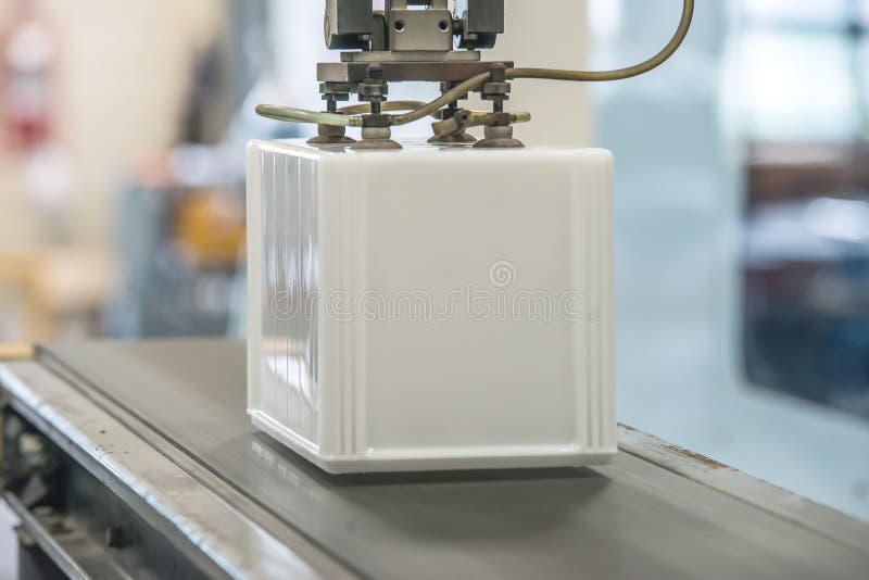 Industrial robot working in factory stock images