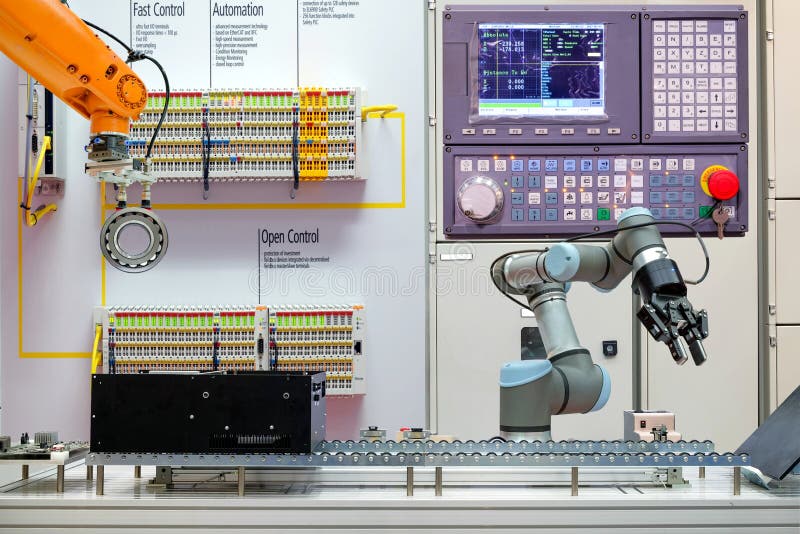 Industrial robotics automation working via conveyor belt on smart factory, stock photo Industrial robotics automation working via conveyor belt on smart factory, stock photo