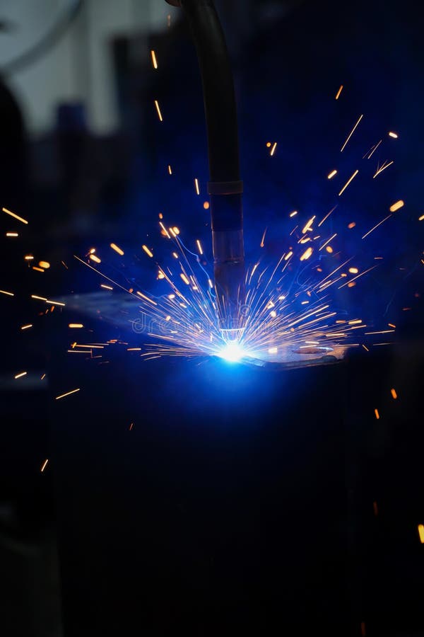 Industrial robots are welding in a car body factory,The concept of using robots to work instead of humans stock photos