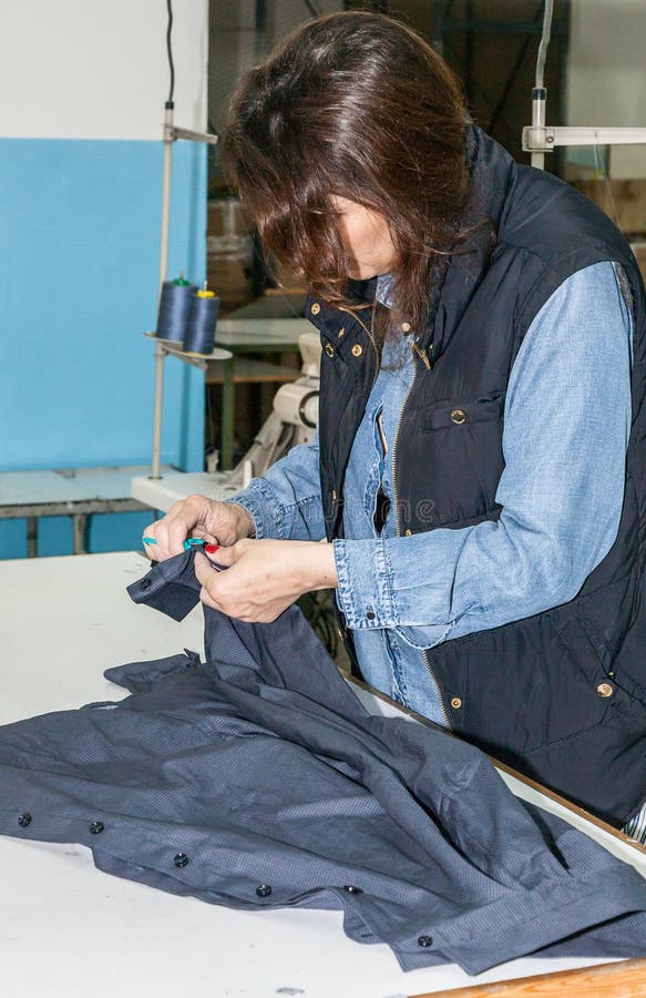 Industrial Sewing Machines with Sewing Machine Operator Stock Photo