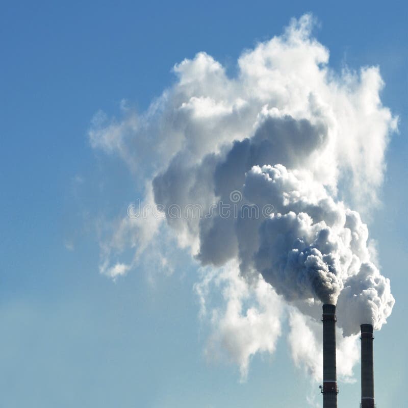 Industrial smoke from chimney on sky stock images