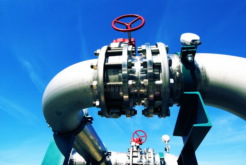 Industrial Steel pipelines valves blue sky