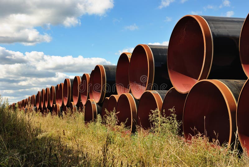 Steel Pipes Stacked stock photo. Image of grass, engineering 25862780