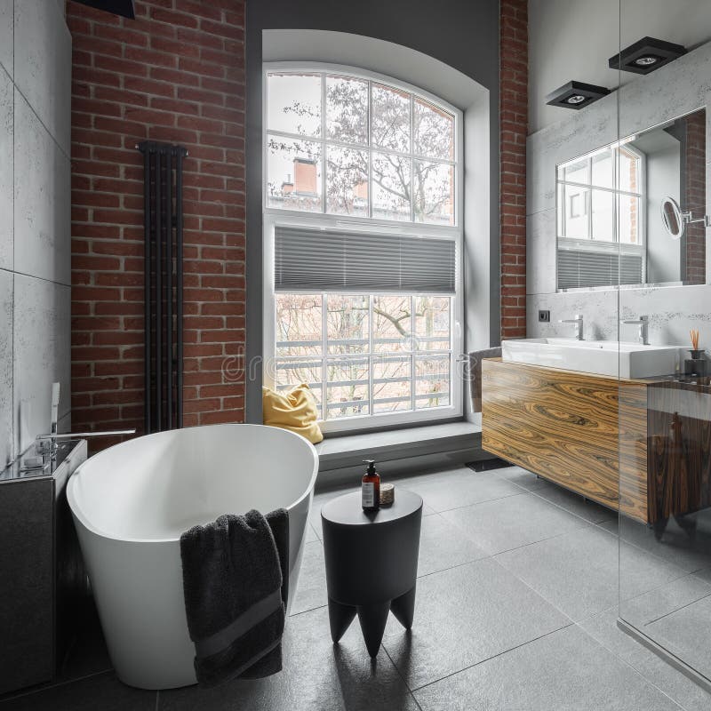 Industrial style bathroom with oval bathtub royalty free stock photos Industrial style bathroom with oval bathtub royalty free stock photos