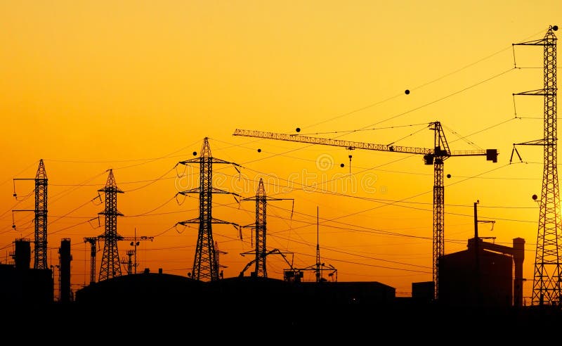 Powerlines and industrial element on a sunset background. Industrial lights stock images, royalty-free photos and pictures