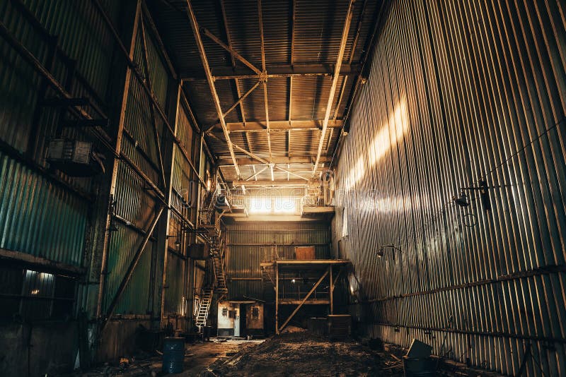 Industrial warehouse or factory building inside, abandoned or empty manufacturing royalty free stock image
