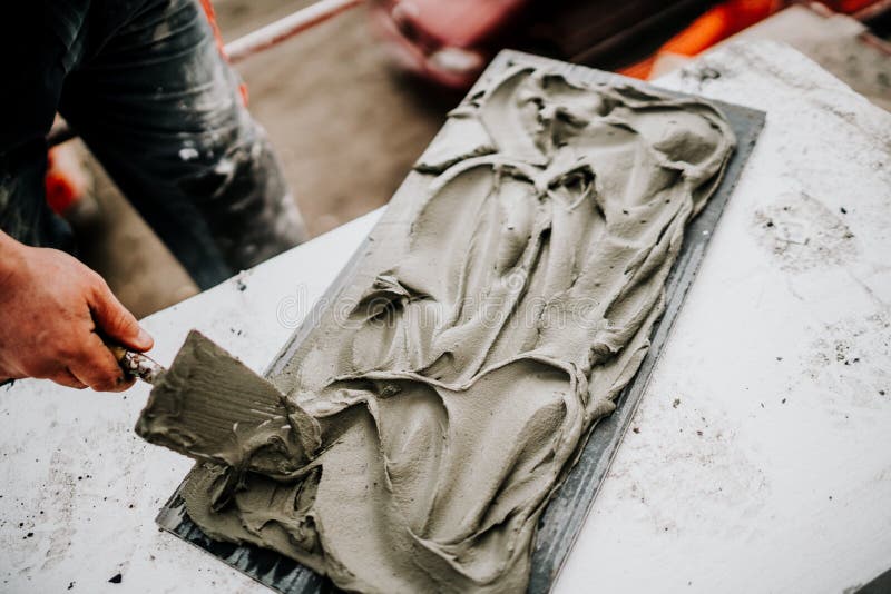 Industrial worker hands working on construction site and placing stone tiles on facade, architecture details. Bricklayer tiler stock images, royalty-free photos and pictures