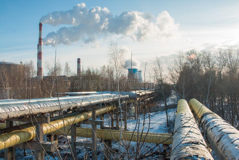 Industrial zone, water and smoke pipes, heat loss winter, environmental pollution