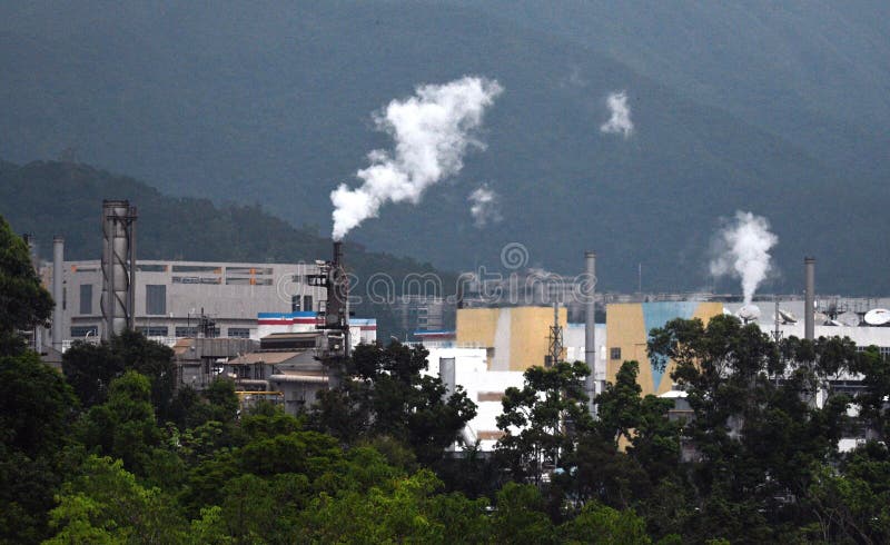 Industrial Factories emitting white smokes in Taipo in Hong Kong. Industrial Factories emitting white smokes in Taipo in Hong Kong