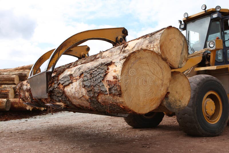 Industrial grabber truck carrying large timber logs. Industrial grabber truck carrying large timber logs