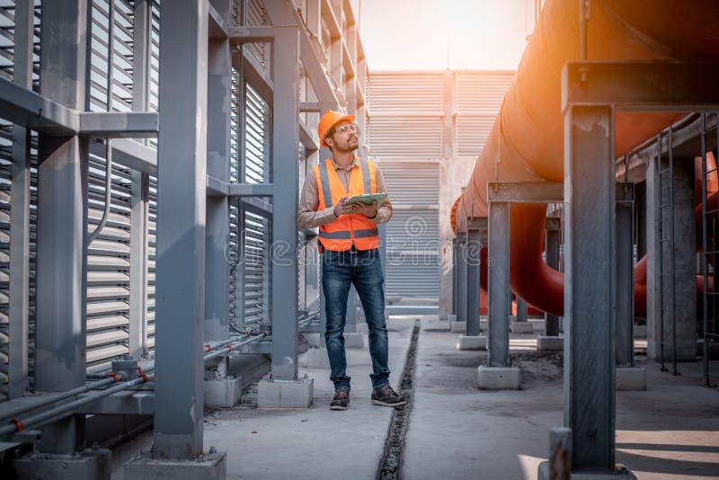 Industry engineer under checking the industry cooling tower air conditioner is water cooling tower air chiller HVAC of large indus