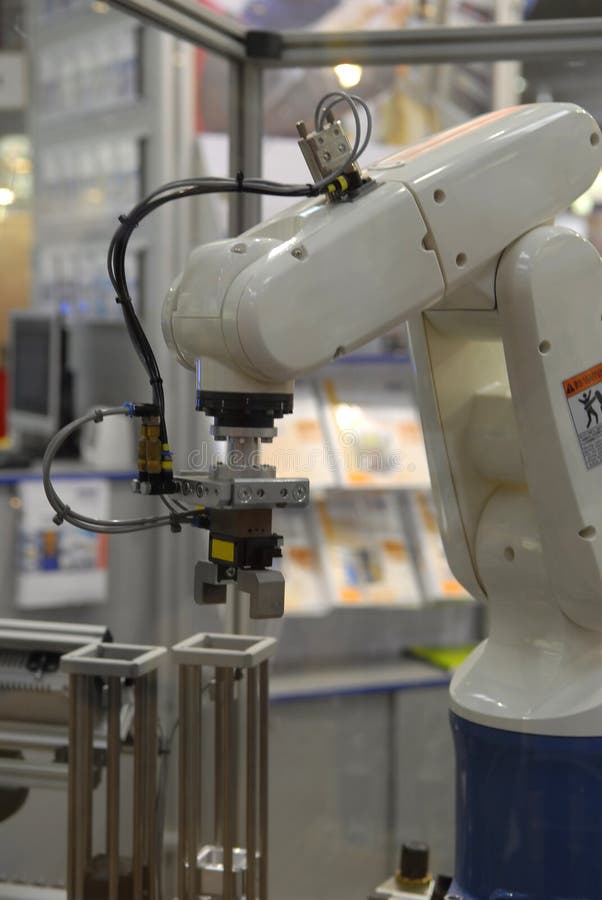 Small industry robot at work. Claw machine stock images, royalty-free photos and pictures