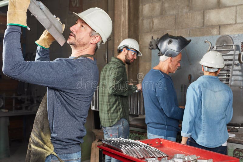 Industry worker controlling metallurgy component stock photos Industry worker controlling metallurgy component stock photos