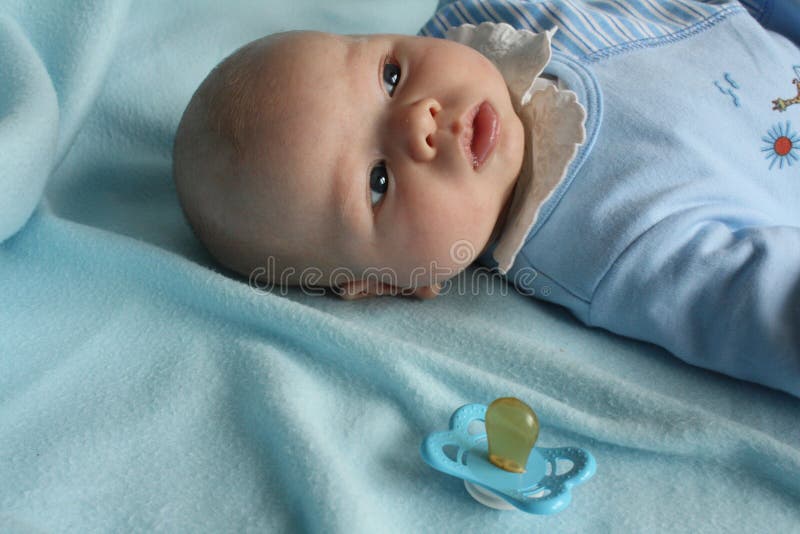 Infant Baby Boy with a Dummy Stock Photo Image of fist, small 13115738