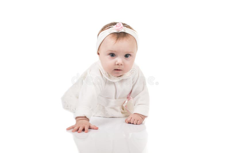 Infant child baby girl toddler crawling happy looking straight isolated on a white background stock images Infant child baby girl toddler crawling happy looking straight isolated on a white background stock images