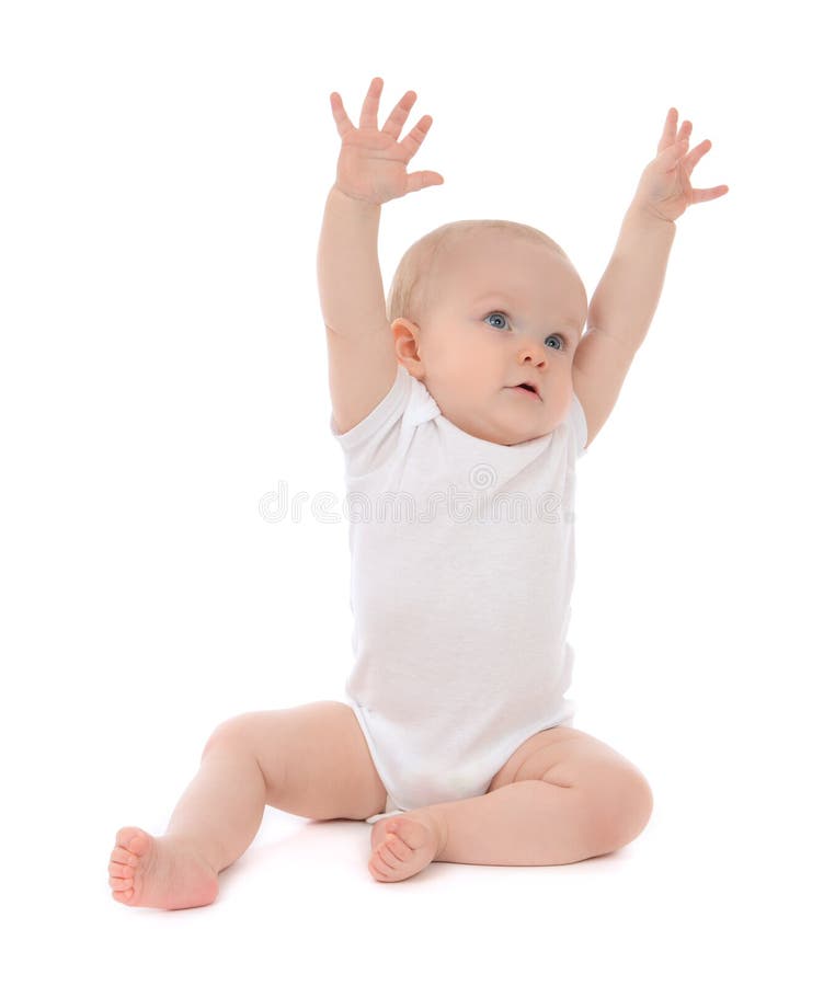 Infant child baby toddler sitting hands up royalty free stock photography Infant child baby toddler sitting hands up royalty free stock photography