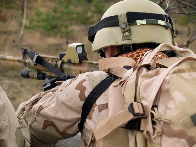 US Marine on position fighting off the enemy. US Marine on position fighting off the enemy