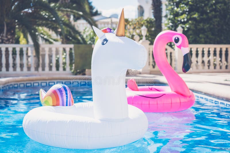 Download Inflatable Colorful White Unicorn And Pink Flamingo At The Swim Pool. Vacation Time In The Swimming Pool With Plastic Stock Photo - Image of beautiful, happiness: 118063414