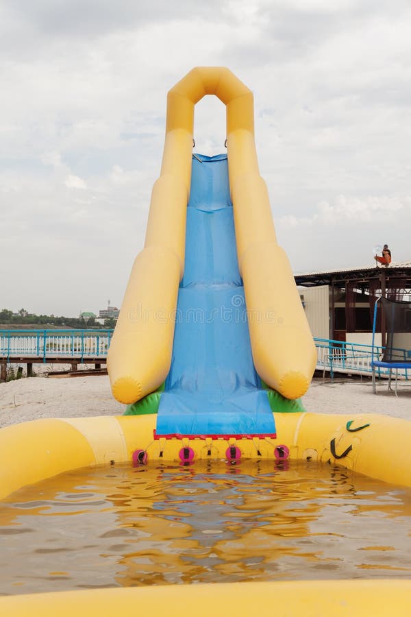 Inflatable Water Slide on the Beach in Summer Stock Image Image of