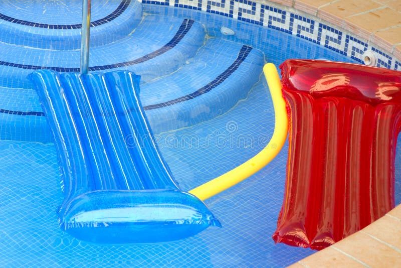 Coloured inflatables on a swimming pool. Coloured inflatables on a swimming pool