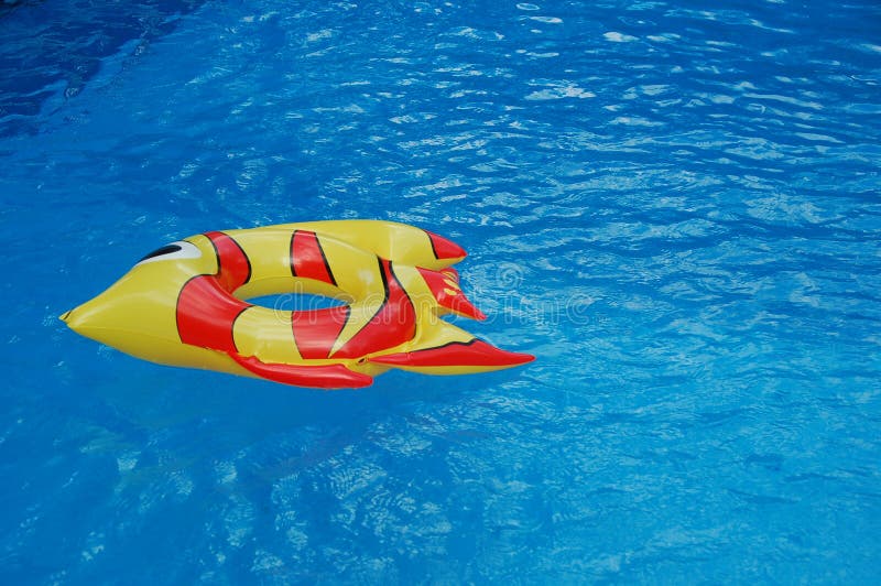 Inflated Toys In A Swimming Pool royalty free stock image