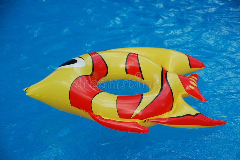 Inflated Toys In A Swimming Pool stock photo