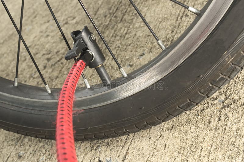 Inflating bicycle wheel stock image. Image of spoke, pump 43583497