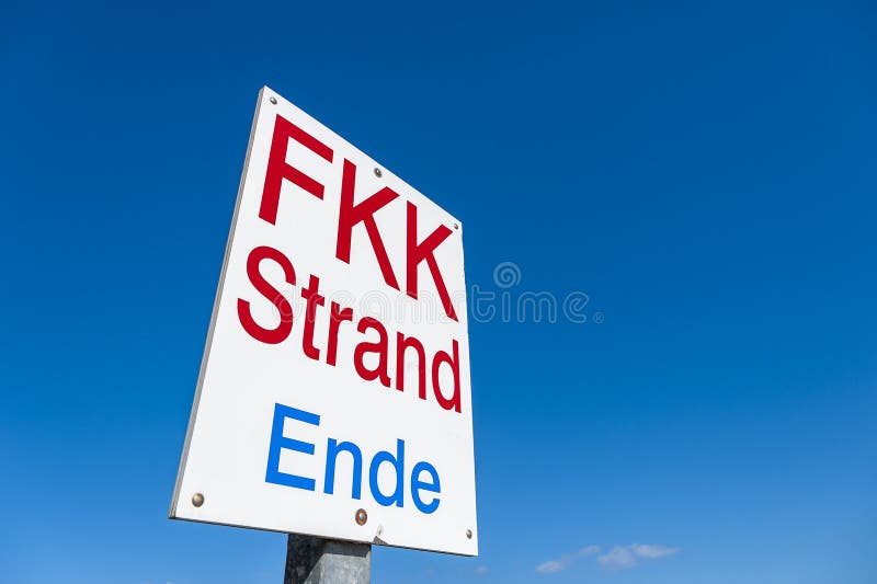 Information board for the end of Nudist beach near Travemünde stock image Information board for the end of Nudist beach near Travemünde stock image