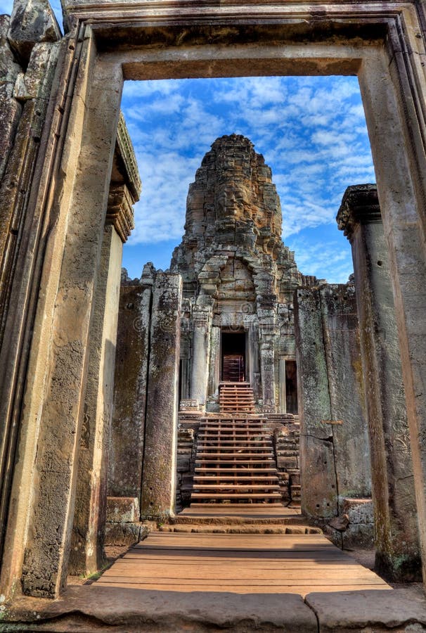 View through door entrance to a statue of bayon temple in angkor wat - Cambodia (HDR). View through door entrance to a statue of bayon temple in angkor wat - Cambodia (HDR)