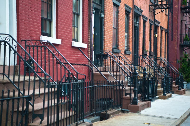 Stairways leading to doors of a row of old apartments. Stairways leading to doors of a row of old apartments.