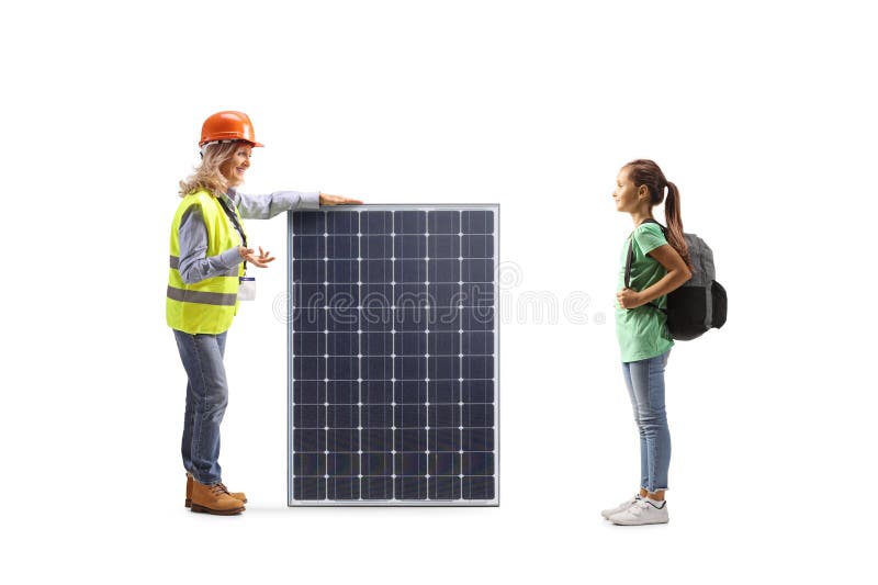Ingeniera mujer hablando con una chica y explicando un panel solar fotografía de archivo libre de regalías