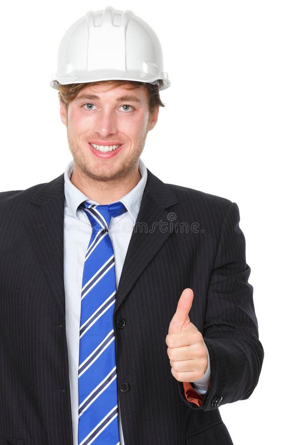 Ingeniero o arquitecto en pulgares acertados del traje para arriba imagen de archivo Ingeniero o arquitecto en pulgares acertados del traje para arriba imagen de archivo