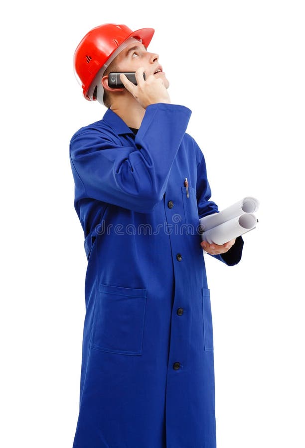 Ingenieur die omhoog terwijl het spreken op de telefoon kijkt royalty-vrije stock foto's Ingenieur die omhoog terwijl het spreken op de telefoon kijkt royalty-vrije stock foto's