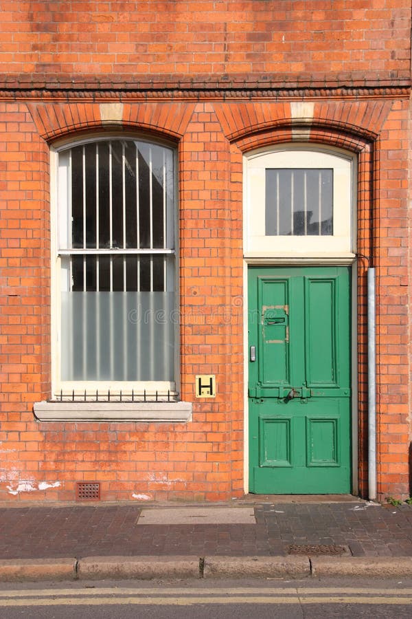 Birmingham Jewellery Quarter. Old brick building and green door. West Midlands, England. Birmingham Jewellery Quarter. Old brick building and green door. West Midlands, England.