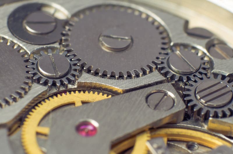 Ingranaggi del metallo di vecchio meccanismo dell'orologio fotografia stock libera da diritti Ingranaggi del metallo di vecchio meccanismo dell'orologio fotografia stock libera da diritti