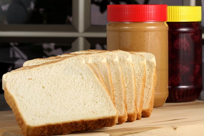 Ingrdients del panino del burro e della gelatina di arachide fotografia stock Ingrdients del panino del burro e della gelatina di arachide fotografia stock
