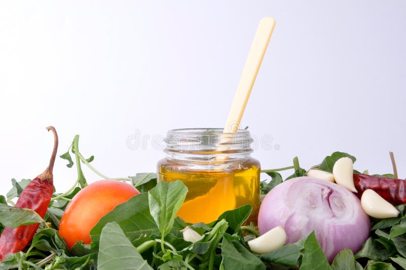 Kitchen ingredients oil, tomato, onion pepper and spinach. Kitchen ingredients oil, tomato, onion pepper and spinach