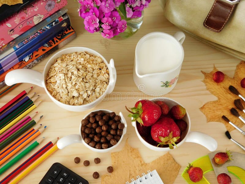 Ingredients for breakfast surrounded by school supplies