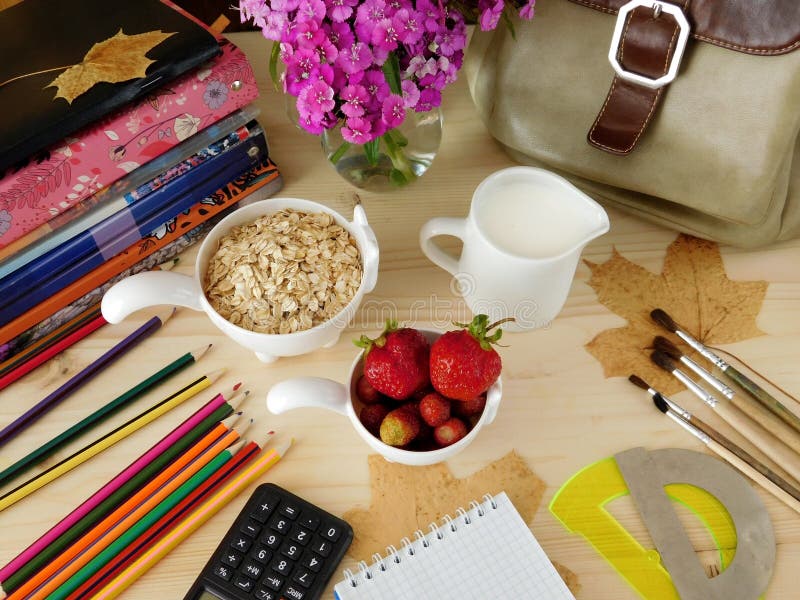 Ingredients for breakfast surrounded by school supplies