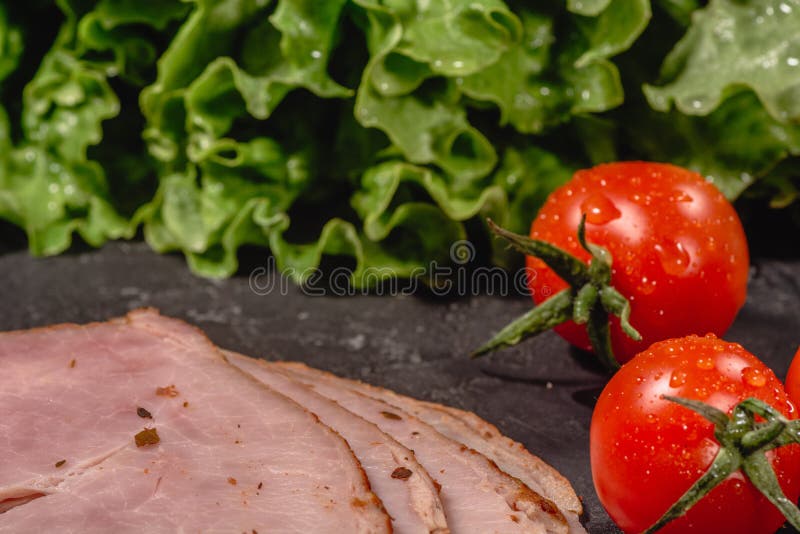 Ingredients for cooking Italian bruschetta on dark table. Italian bruschetta with cherry tomatoes, cheese sauce, salad leaves, stock photo Ingredients for cooking Italian bruschetta on dark table. Italian bruschetta with cherry tomatoes, cheese sauce, salad leaves, stock photo