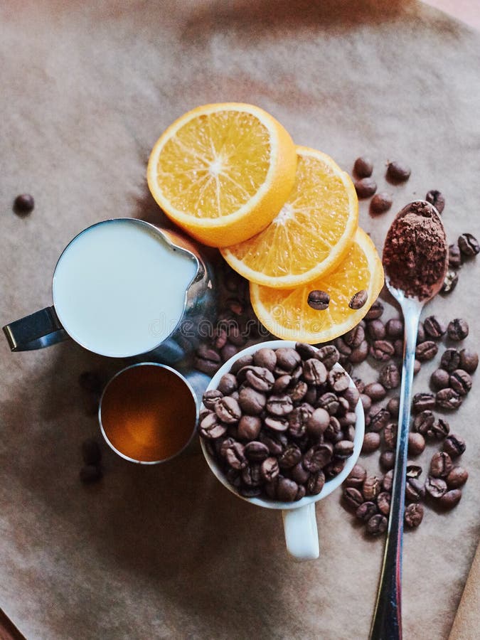 Ingredients for Making a Sweet Coffee Drink with Orange Stock Photo