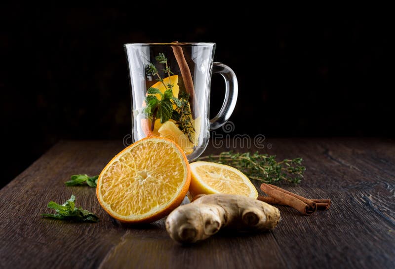 Ingredients for Making Vitamin Tea with Orange, Lemon, Mint, Thyme, Ginger Root and Cinnamon