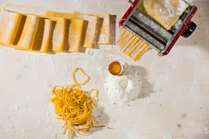 Ingredients for Tagliatelle Pasta and Machine Pasta Cutter Stock Image
