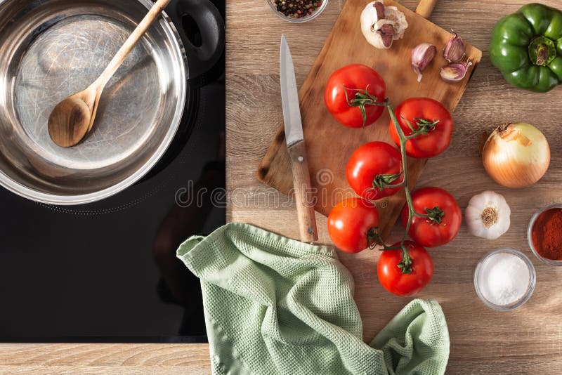 Ingredients To Make Tomato Sauce on the Kitchen Counter Stock Photo