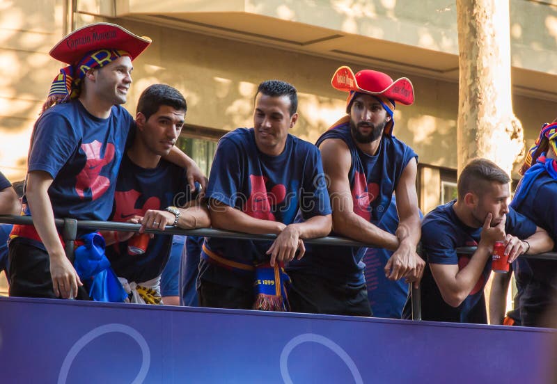Iniesta, Suarez, Pedro, Jordi Alba Barça treble celebration. Andres Iniesta, Luis Suarez, Pedro and Jordi Alba with Martin Montoya riding on top of the roofless royalty free stock images Iniesta, Suarez, Pedro, Jordi Alba Barça treble celebration. Andres Iniesta, Luis Suarez, Pedro and Jordi Alba with Martin Montoya riding on top of the roofless royalty free stock images