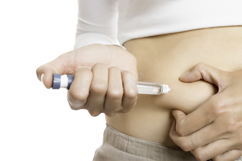 Injecting insulin with a pen stock photo Injecting insulin with a pen stock photo