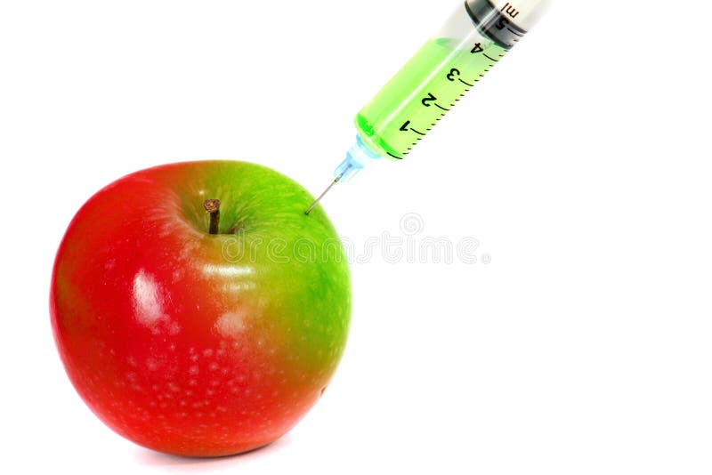 Injection green into red fresh wet apple with syringe on white background for renew energy , therapy or refresh or boost up energy