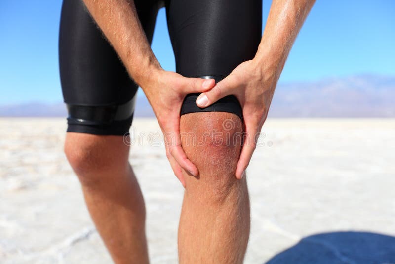 Injuries - sports running knee injury on man royalty free stock photo Injuries - sports running knee injury on man royalty free stock photo