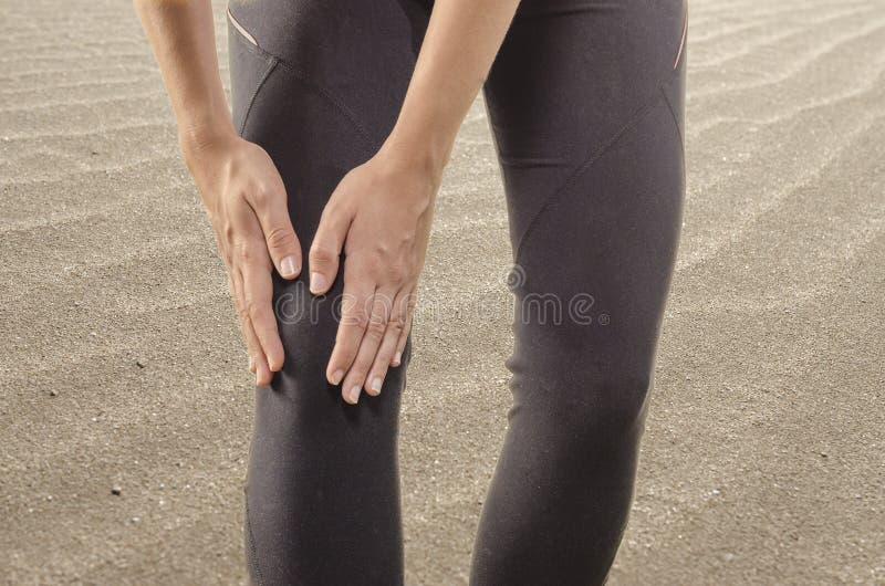 Injuries - sports running knee injury on woman. Woman runner wit